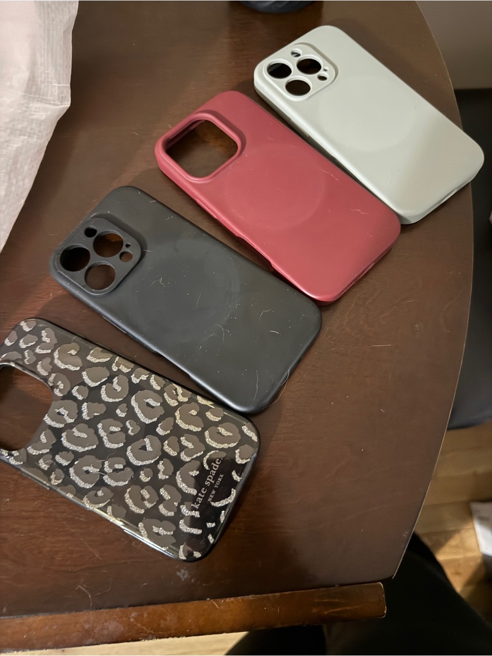 Four iPhone 16 pro cases - mag safe - leopard is Kate Spade.